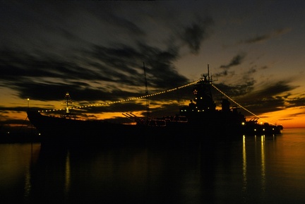 USS IOWA (BB 61) decorated with Christmas lights-december-1984